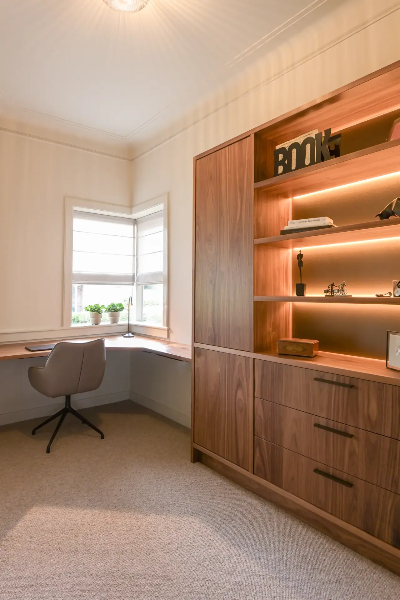 Office with a desk and bespoke cupboards